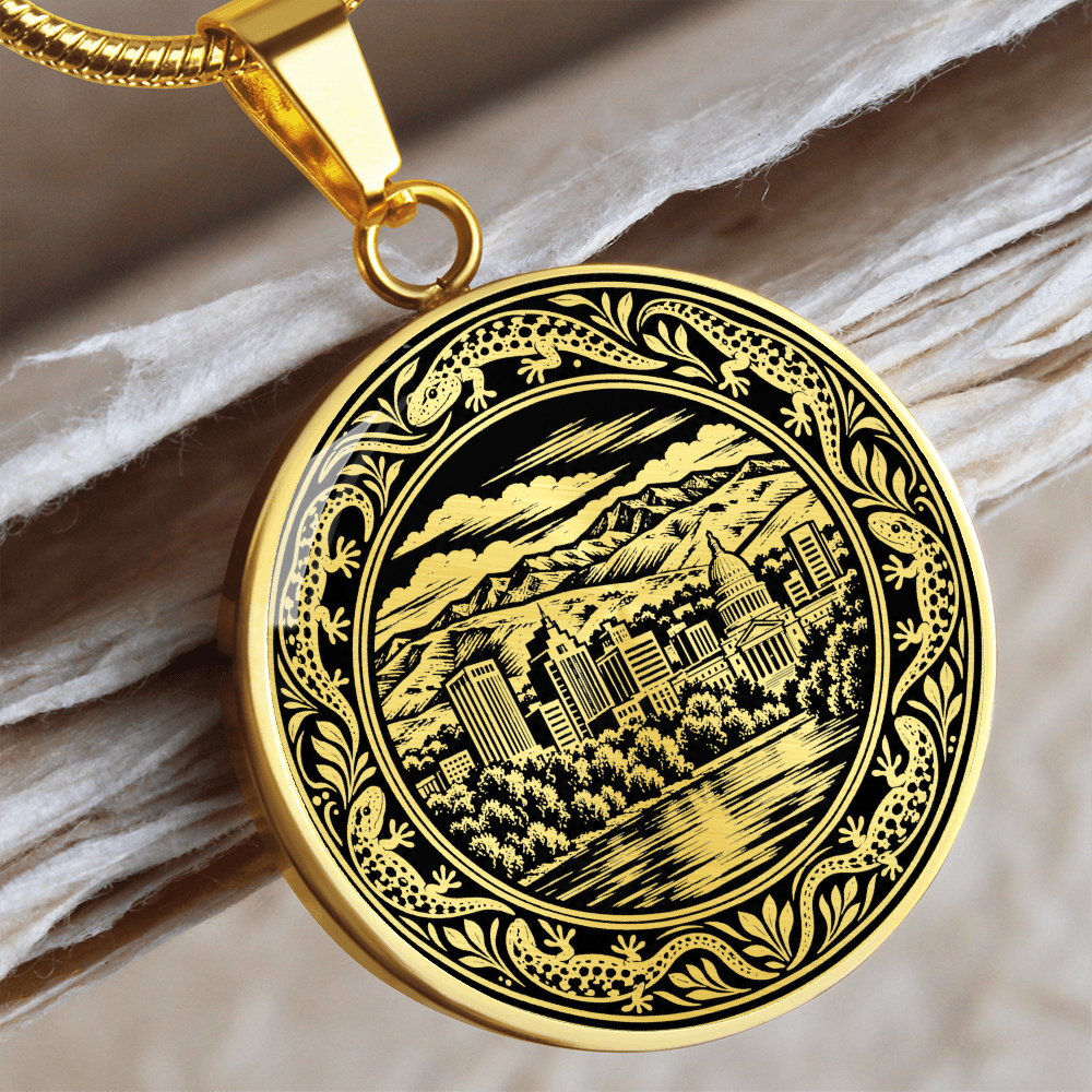 Gold finish Boise skyline pendant with mountain cityscape, decorative leaves, small wildlife-inspired motifs and ornate black and gold artwork