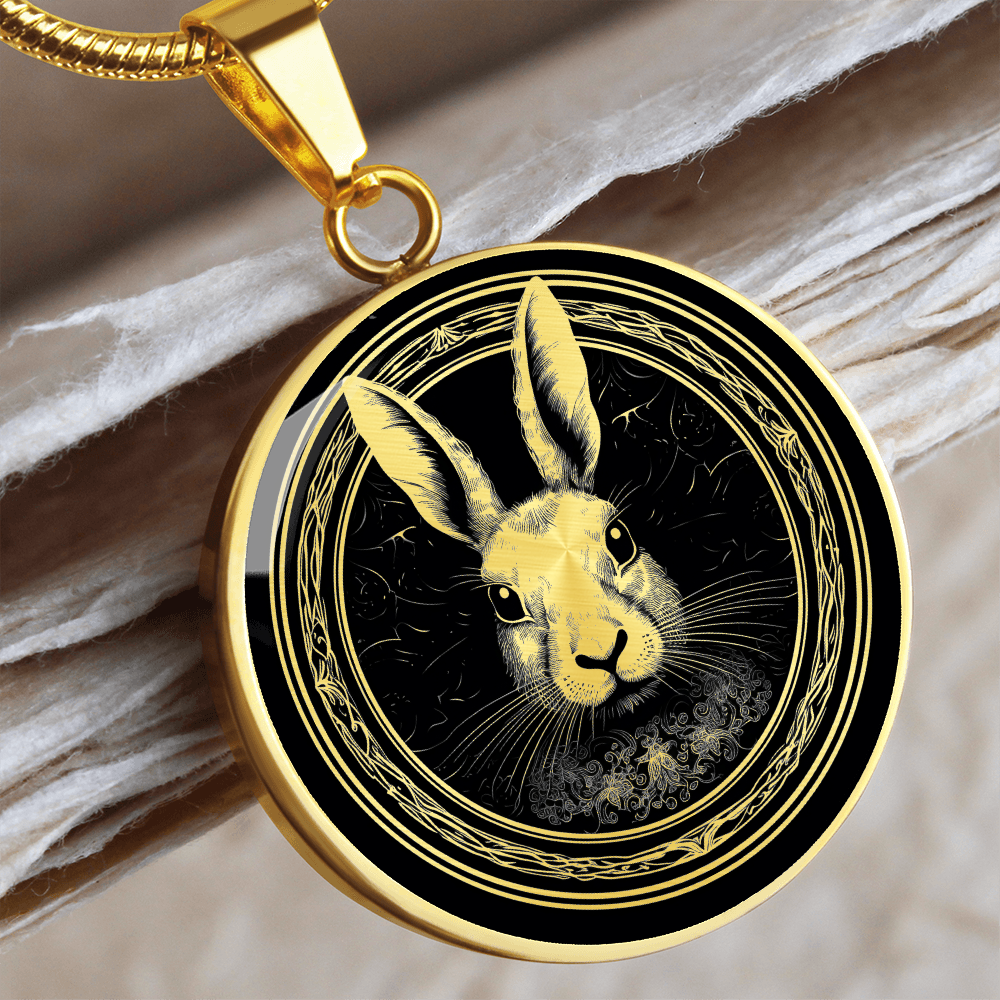 William Morris-inspired rabbit necklace featuring a black-and-white rabbit portrait with long ears and ornate botanical border on a round pendant.