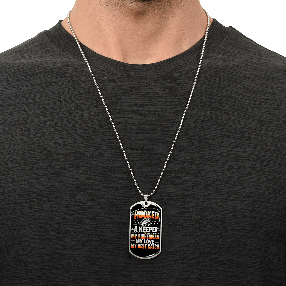 Fishing-themed dog tag necklace worn as an everyday accessory
