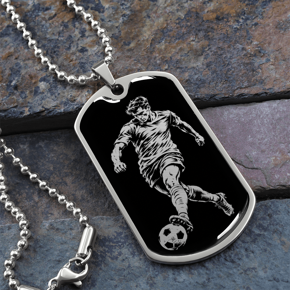 Surgical steel soccer dog tag pendant featuring a footballer kicking a ball