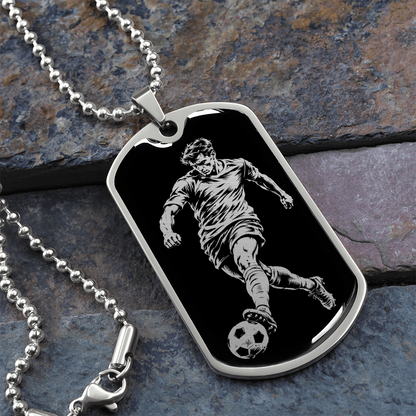 Surgical steel soccer dog tag pendant featuring a footballer kicking a ball
