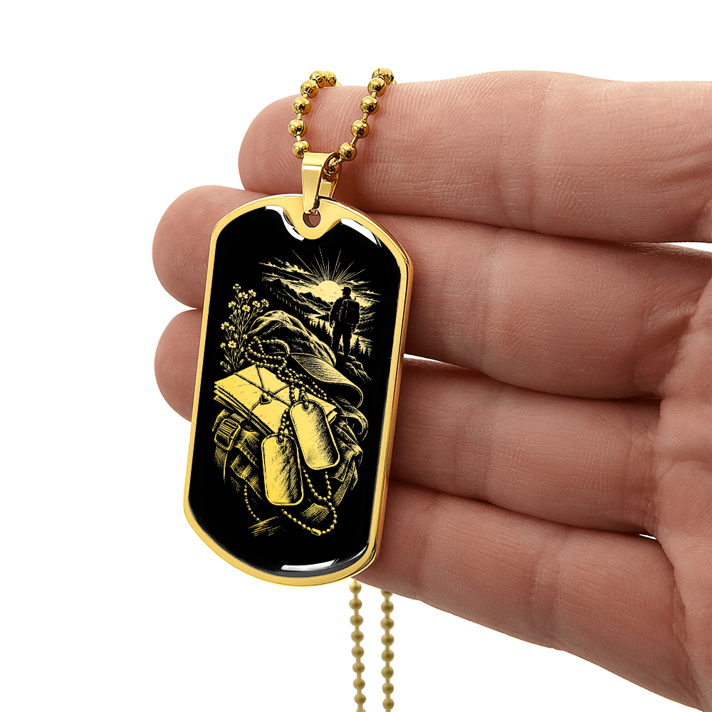 18K gold finish long distance military dog tag necklace with gold-toned illustration of backpack, letters and sunrise on black.