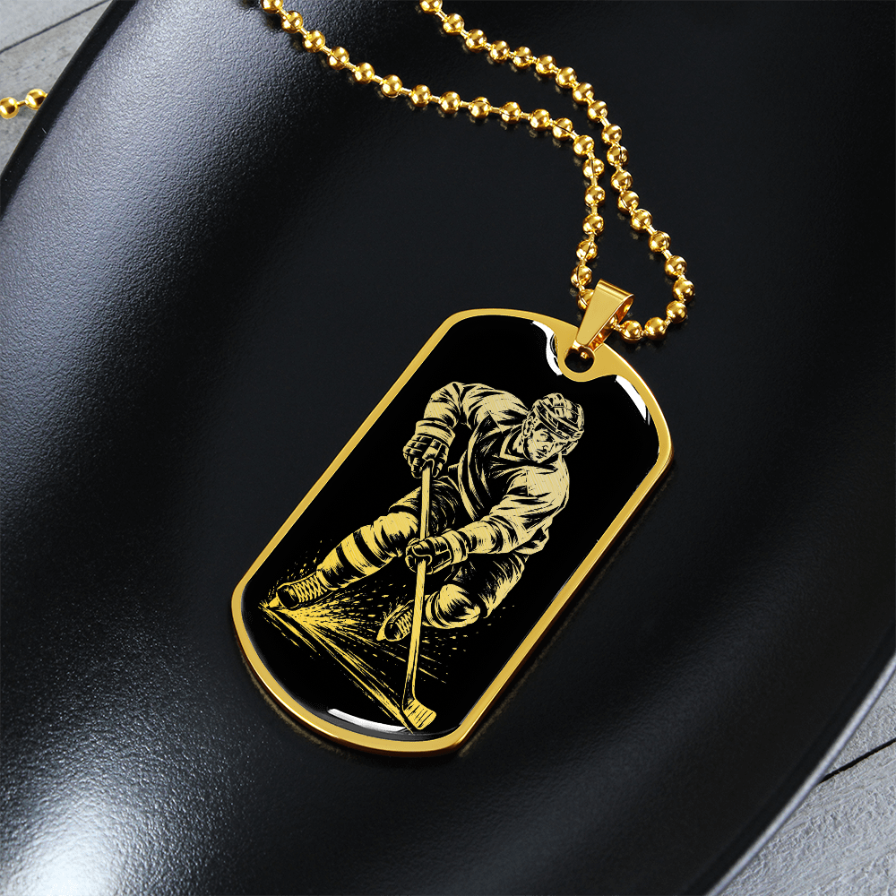 Gold finish hockey dog tag necklace with bold black-and-white hockey artwork
