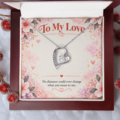 Silver-toned Forever Love heart necklace displayed in black gift box with floral To My Love card and romantic distance message.