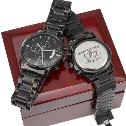 Black long distance relationship watch for men showing front chronograph-style dial and engraved back reading No Matter the Miles Always Yours.