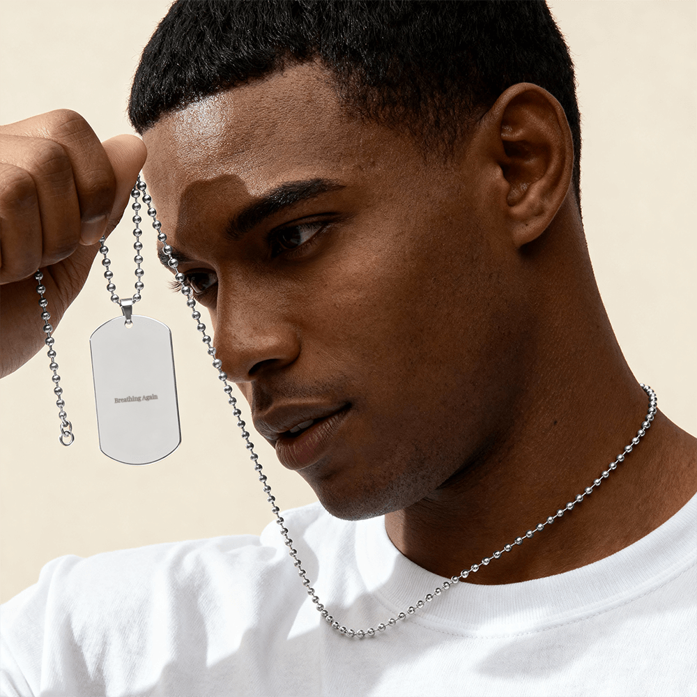 Minimal engraved necklace with “Breathing again” text