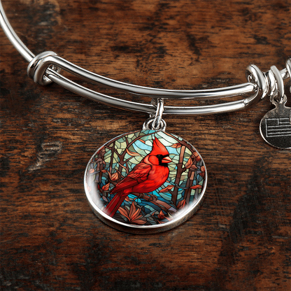 Red cardinal bracelet with circular cardinal bird charm on expandable bangle