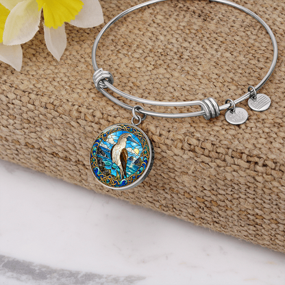 Expandable booby bracelet with circular 23.5 mm bird charm