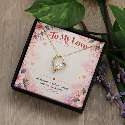14K white gold finish Forever Love necklace featuring an open-heart pendant with clear cubic zirconia stones on a floral message card.