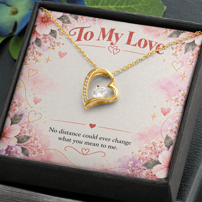 14K white gold finish Forever Love necklace featuring an open-heart pendant with clear cubic zirconia stones on a floral message card.